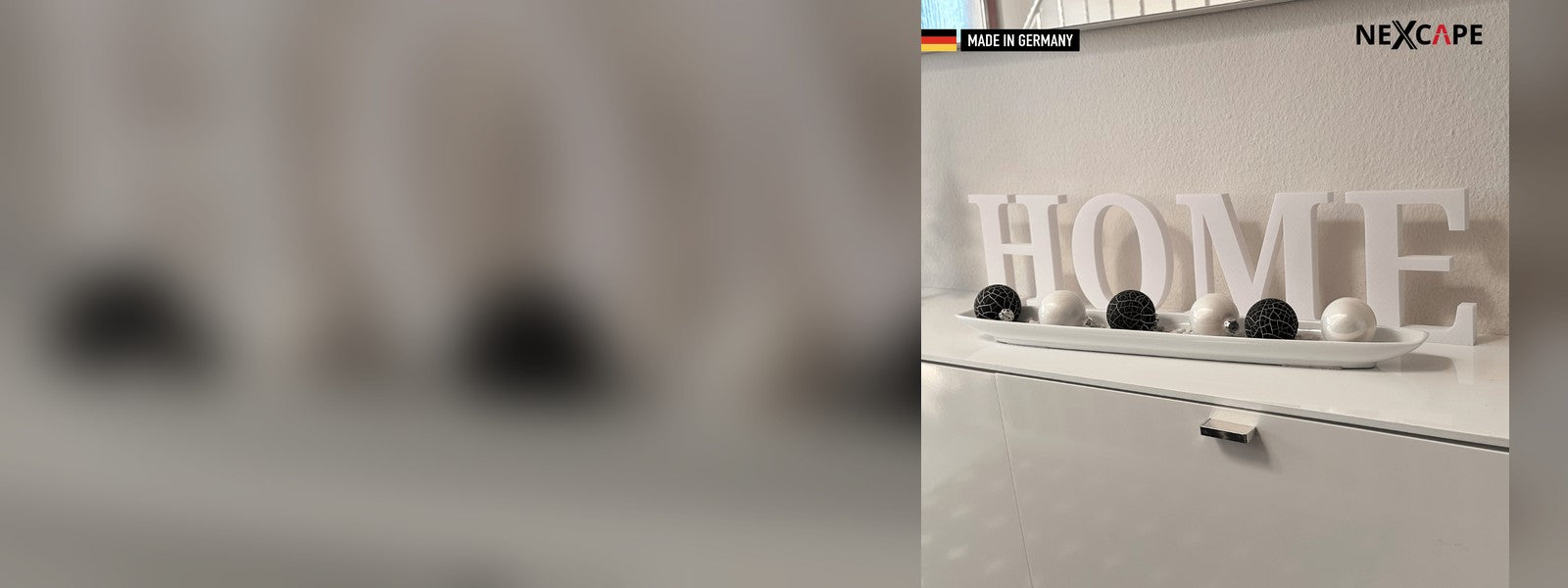 3D-gedruckte Wandbuchstaben HOME von NEXCAPE auf einem Sideboard