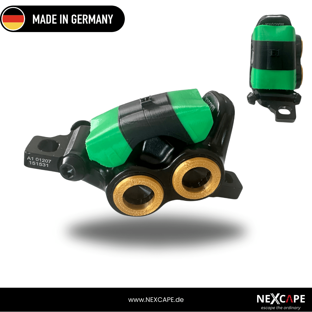 NEXCAPE Schmutzfänger (Mud Cover) in Grün auf dem Magura MT5/MT7 Bremssattel montiert – Bremssattel-Schutzblende gegen Schmutz fürs MTB/E-Bike, Made in Germany